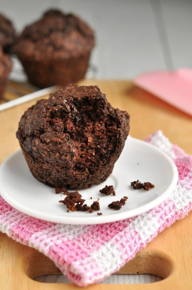 A healthy double chocolate bran muffin with a bite taken out