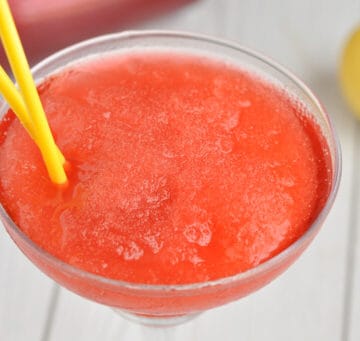 An overhead shot of a glass of Strawberry Vodka Slush Cocktail