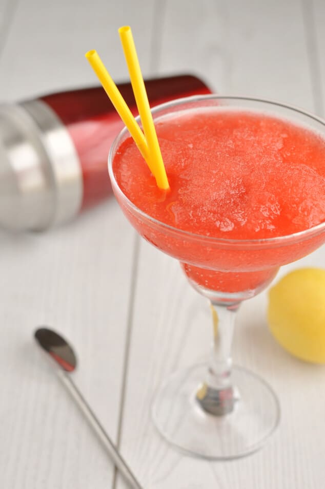 A margarita glass filled with Strawberry Vodka Slush Cocktail