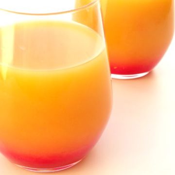Tequila Sunrise #Cocktail #Recipe - the colours of this gorgeous tequila cocktail are so striking, making it the perfect WOW drink to serve guests at a party! Plus it's only made from three basic ingredients and the layering technique is so simple that anyone can do it! | www.happyhealthymotivated.com