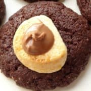 Hot Cocoa Cookies Recipe - these cookies are easy to make, look incredible and taste out of this world! They're made of a rich and crumbly chocolate cookie topped with gooey melted marshmallow and some chocolate spread. Best dessert/snack ever! | www.happyhealthymotivated.com