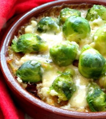 Lighter Brussels Sprouts Gratin Recipe - looking for a healthy Christmas side dish to help keep it light this year? These brussels sprouts au gratin is perfect! Crispy pan-fried brussels sprouts baked with ooey-gooey melted cheese. Heaven! | www.happyhealthymotivated.com