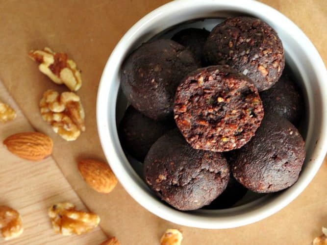 Raw Vegan Brownie Bites Recipe - these bite-sized brownie balls are vegan, gluten-free, paleo and healthy! They taste so good (seriously - just like a rich chocolate brownie) that you'd never know they were secretly good for you!