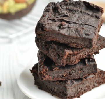 Healthy vegan brownies stacked on a plate