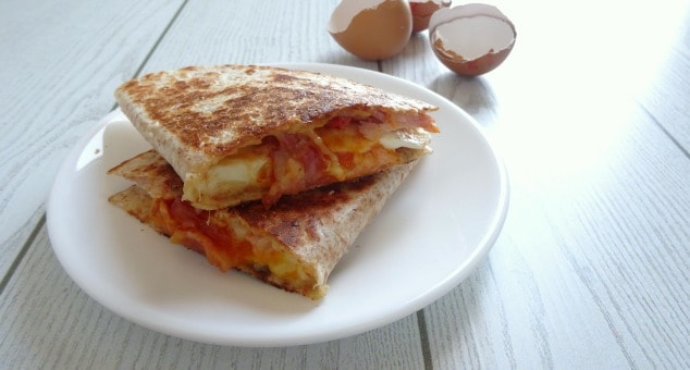 Easy Breakfast Quesadilla Recipe. A really fast and simple breakfast quesadilla loaded with smoky bacon, a soft fried egg and melted cheddar cheese. It comes together in just 10 minutes so you can even make it on a weekday morning! Don't have time to make it before work or school? Save it and have it as breakfast for dinner instead!
