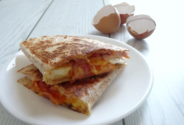 Easy Breakfast Quesadilla Recipe. A really fast and simple breakfast quesadilla loaded with smoky bacon, a soft fried egg and melted cheddar cheese. It comes together in just 10 minutes so you can even make it on a weekday morning! Don't have time to make it before work or school? Save it and have it as breakfast for dinner instead!