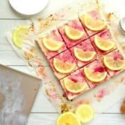 Healthy Lemon Raspberry Cheesecake Bars Recipe. This healthy dessert recipe is so summery and amazing! The base is a real buttery graham cracker crust and the filling is smooth, creamy and delicious. Just like a real cheesecake, but without all the fat, sugar and calories!