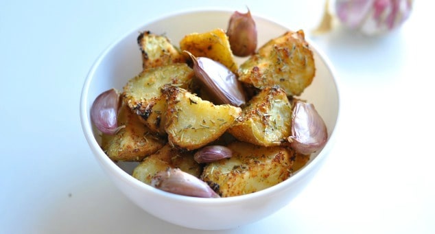 Easy Roasted Potatoes with Garlic and Rosemary Recipe | No doubt about it, these really are the best roasted potatoes in the world! They're made with healthy olive oil and take less than an hour to make. Definitely going to make these for Thanksgiving and Christmas!