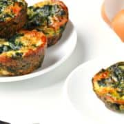 Healthy Breakfast Egg Muffins with Bacon + Spinach Recipe | Get ready because these light and fluffy muffins of deliciousness will soon become your favorite healthy breakfast! They're quick and easy to make - perfect for busy weekday mornings.