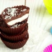 Coconut Chocolate Candy Cups Recipe | These bite-size treats are my favorite healthy summer snack ever! They're quick, easy and cheap to make and taste like gourmet candy! I always make a big batch at the start of summer so I know I've got enough to last.