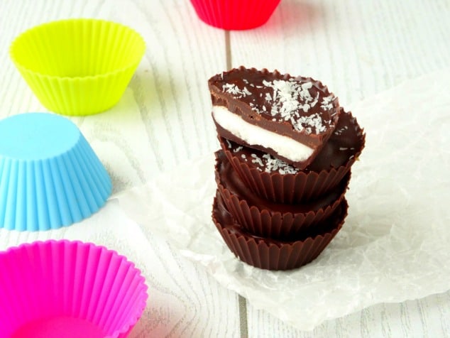 Coconut Chocolate Candy Cups Recipe | These bite-size treats are my favorite healthy summer snack ever! They're quick, easy and cheap to make and taste like gourmet candy! I always make a big batch at the start of summer so I know I've got enough to last.