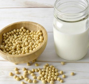 Soy milk with a bowl of soy beans