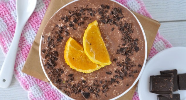 A bowl of rich and creamy chocolate orange overnight oats topped with slices of orange